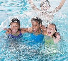 children playing in pool