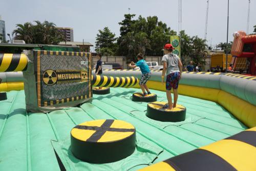 boy jumping on inflatable trampoline