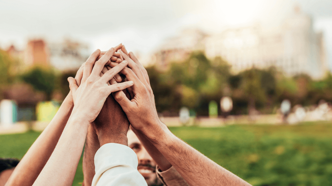 Community of millennial people stacking hands together - Multiracial college students putting their hands on top of each other - Human relationship, social, community and team building concept