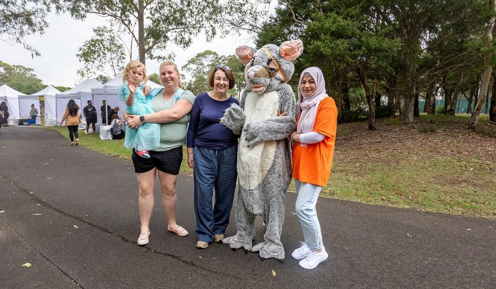 Me with Paint Cumberland REaD’s Poppy the Possum and attendees at Cumberland’s   Biggest Playgroup for Harmony Week.